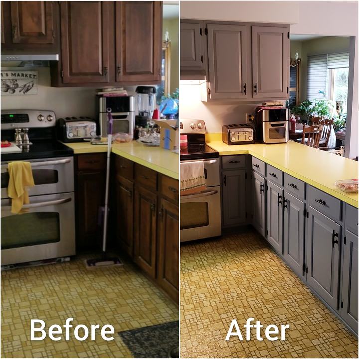 Honey-oak kitchen cabinets painted a warm gray