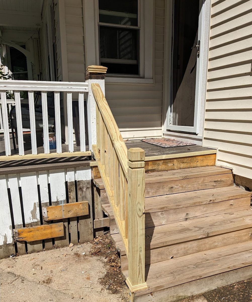 Before: Raw wood porch steps and railing painted white
